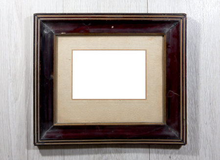 Old photo frame on wooden wall