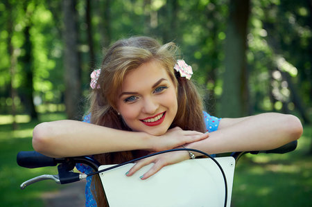 Girl on bicycle in the parkの写真素材
