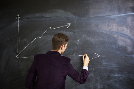 Man writing on the chalkboardの写真素材