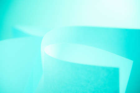 Abstract twisted sheets of blue paper. backround.の写真素材