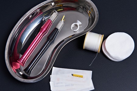Tools for permament eyebrows make-up and thread correction on plateの写真素材