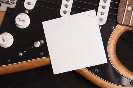 Blank paper with electric guitar. Use for music application or poster.の写真素材