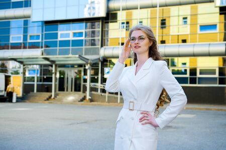 Portrait of a smiling business woman in glassesの写真素材