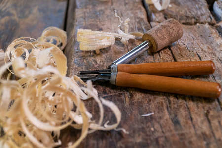 Joiner tools on an old workbench. Traces of wood processing. Workplace of a wood craftsman.の写真素材