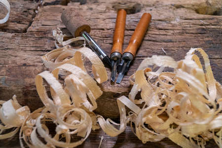 Joiner tools on an old workbench. Traces of wood processing. Workplace of a wood craftsman.の写真素材