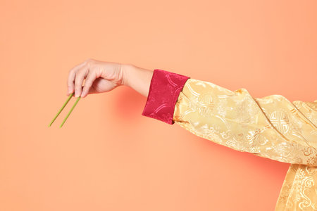 Happy Chinese new year. asian chinese senior man wearing golden traditional cheongsam qipao or...