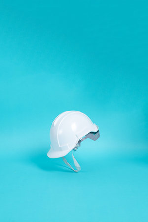 White safety helmet on blue background. hard hat isolated on blue background.の写真素材