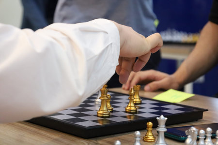 Group of friends playing chess during tournament in class. Board game, Youth, hand, Gen Z,...