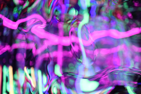 Abstract Glittered Textured Radial Foil Neon Light on Black Background, shapes of liquid chrome...