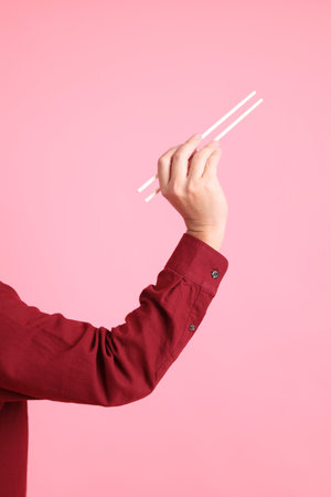 Happy Chinese New Year, asian senior man in formal and casual red shirts with gesture of hand...