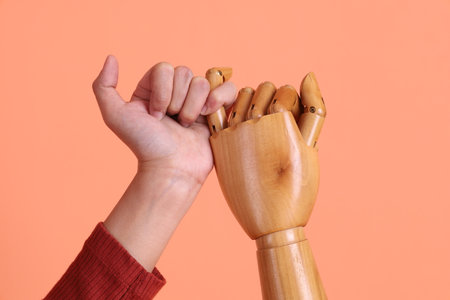 Hand of mannequin with multiple poses isolated on yellow background. Symbol, Puppet.の写真素材