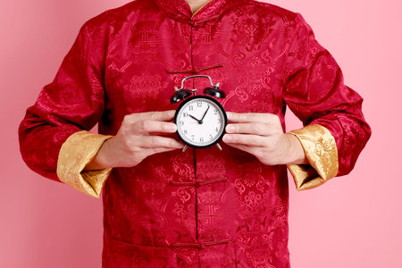 Happy Chinese new year. Asian Chinese senior man wearing red traditional cheongsam qipao or...