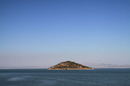 Small island on the largest lake in Turkeyの写真素材