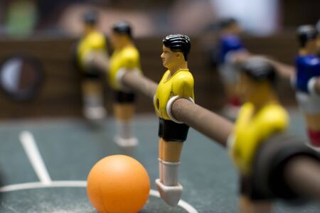 foosball game yellow team close upの写真素材