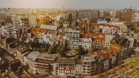Beautiful view of the tiled red roofs of Brussels Belgium on a sunny day. Quiet residential area. Travel Europe. An aerial view droneの写真素材