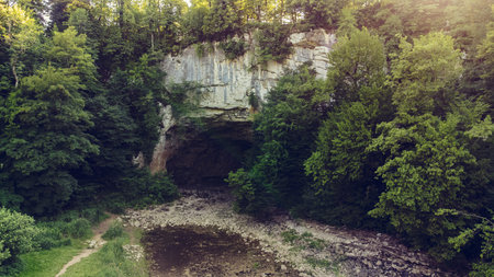 Cave in the forest, Slovenian national park, summertimeの写真素材