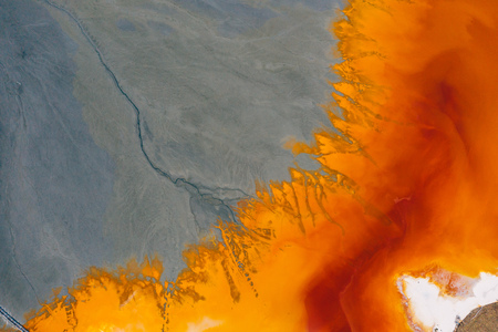 Drone view of contaminated, toxic water stream in Geamana, Romaniaの写真素材