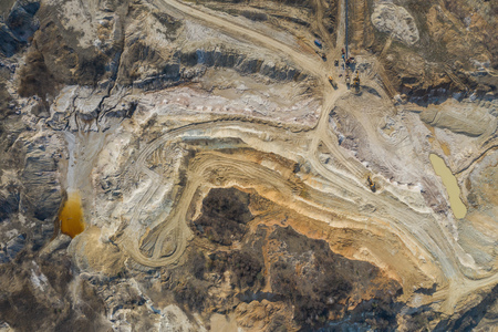 Aerial view of an open mine pit. Exploitation and nature pollutionの写真素材