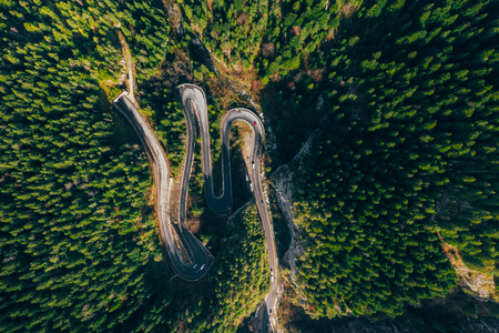 Drone view of winding forest road in the middle of Bicaz Gorge, Transylvaniaの写真素材