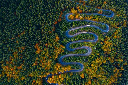 Scenic curvy road seen from a drone in autumn. Cheia, Romania.の写真素材