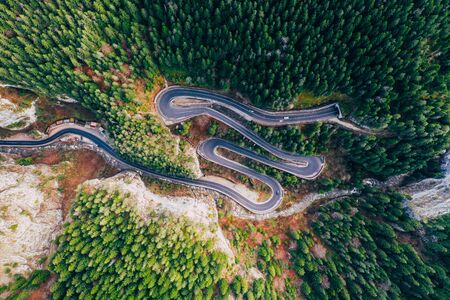 Drone view of winding forest road in the middle of Bicaz Gorge, Transylvaniaの写真素材