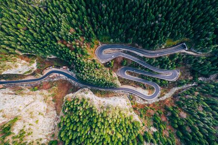 Drone view of winding forest road in the middle of Bicaz Gorge, Transylvaniaの写真素材