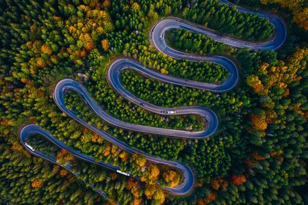Scenic curvy road seen from a drone in autumn. Cheia, Romania.の写真素材