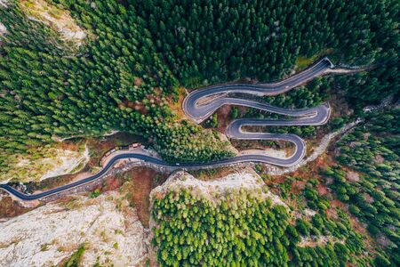 Drone view of winding forest road in the middle of Bicaz Gorge, Transylvaniaの写真素材