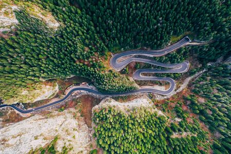 Drone view of winding forest road in the middle of Bicaz Gorge, Transylvaniaの写真素材