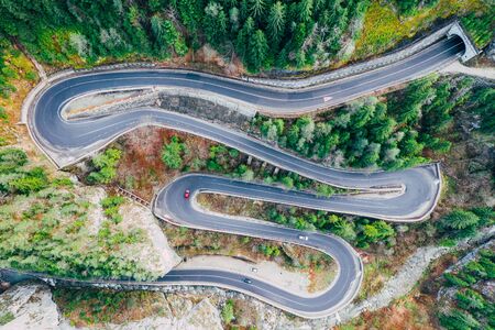 Drone view of winding forest road in the middle of Bicaz Gorge, Transylvaniaの写真素材