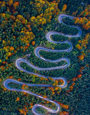 Scenic curvy road seen from a drone in autumn. Cheia, Romania.の写真素材