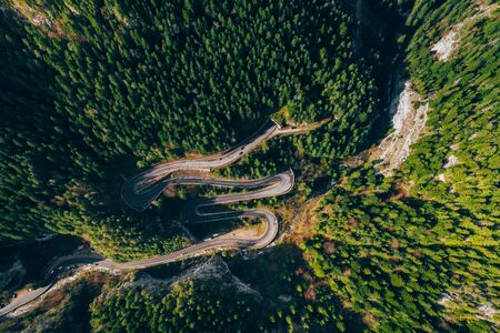 Drone view of winding forest road in the middle of Bicaz Gorge, Transylvaniaの写真素材