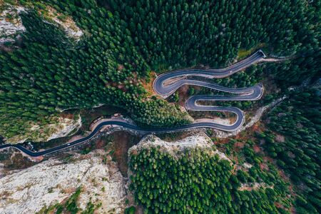 Drone view of winding forest road in the middle of Bicaz Gorge, Transylvaniaの写真素材