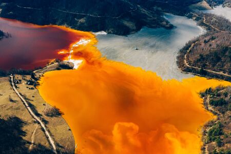 Drone view of contaminated, toxic water stream in Geamana, Romaniaの写真素材