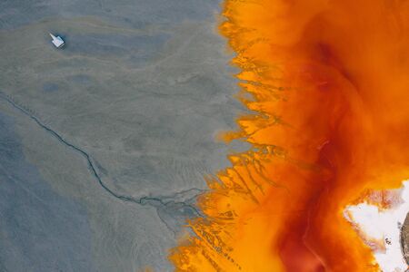 Drone view of contaminated, toxic water stream in Geamana, Romaniaの写真素材