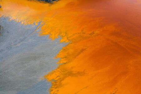 Drone view of contaminated, toxic water stream in Geamana, Romaniaの写真素材
