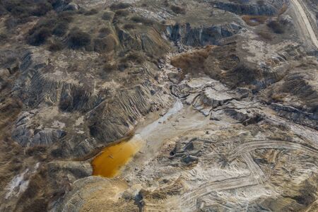 Aerial view of an open mine pit. Exploitation and nature pollutionの写真素材