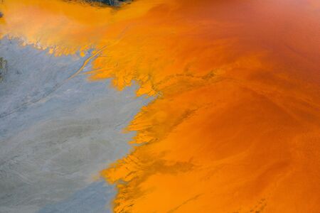 Drone view of contaminated, toxic water stream in Geamana, Romaniaの写真素材