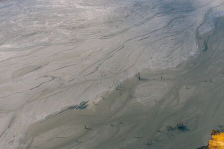 Drone view of contaminated, toxic water stream in Geamana, Romaniaの写真素材