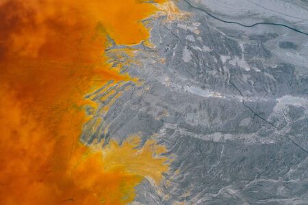 Drone view of contaminated, toxic water stream in Geamana, Romaniaの写真素材