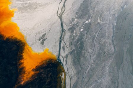 Drone view of contaminated, toxic water stream in Geamana, Romaniaの写真素材