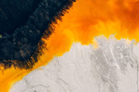 Drone view of contaminated, toxic water stream in Geamana, Romaniaの写真素材