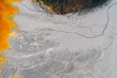 Drone view of contaminated, toxic water stream in Geamana, Romaniaの写真素材