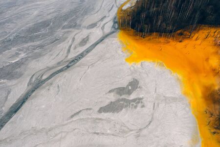 Drone view of contaminated, toxic water stream in Geamana, Romaniaの写真素材