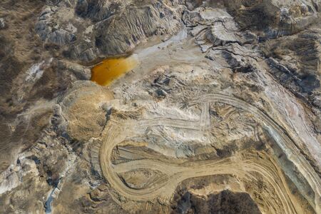 Aerial view of an open mine pit. Exploitation and nature pollutionの写真素材