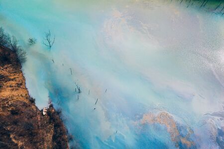 Drone view of contaminated, toxic water stream in Geamana, Romaniaの写真素材