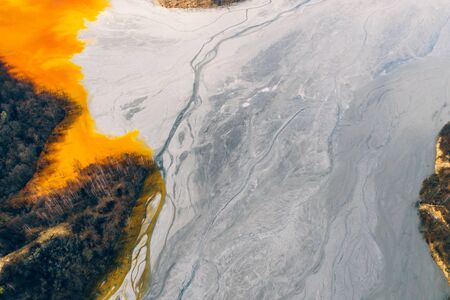 Drone view of contaminated, toxic water stream in Geamana, Romaniaの写真素材