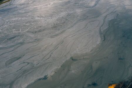 Drone view of contaminated, toxic water stream in Geamana, Romaniaの写真素材