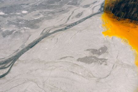 Drone view of contaminated, toxic water stream in Geamana, Romaniaの写真素材