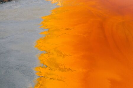 Drone view of contaminated, toxic water stream in Geamana, Romaniaの写真素材